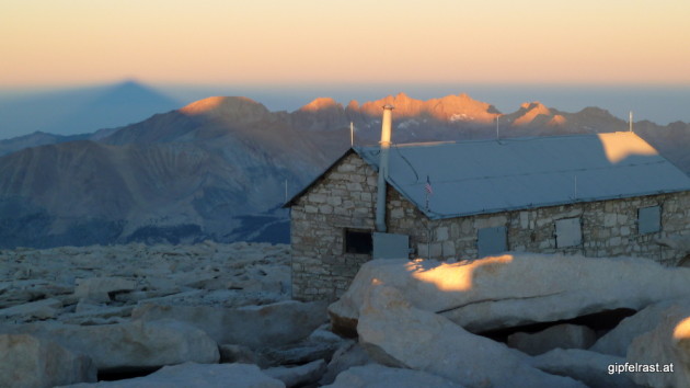 This is the end. The top of Mt. Whitney with its shadow on the left. The downside: no drinks were served in the hut.